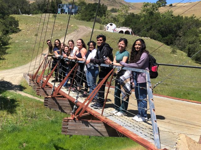 Photo of students exploring a sculpture